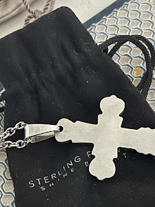 A beautiful sterling silver cross w/ centerpiece diamonds!